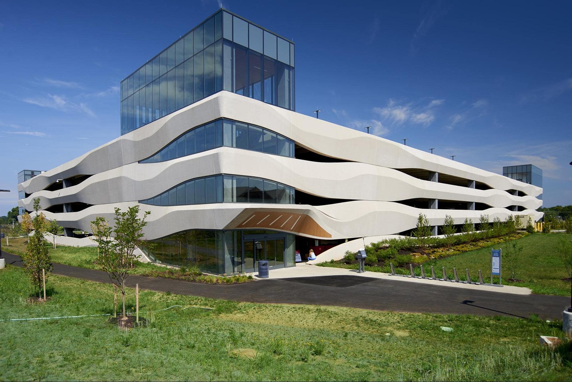 a precast garage with curves as a part of the siding.