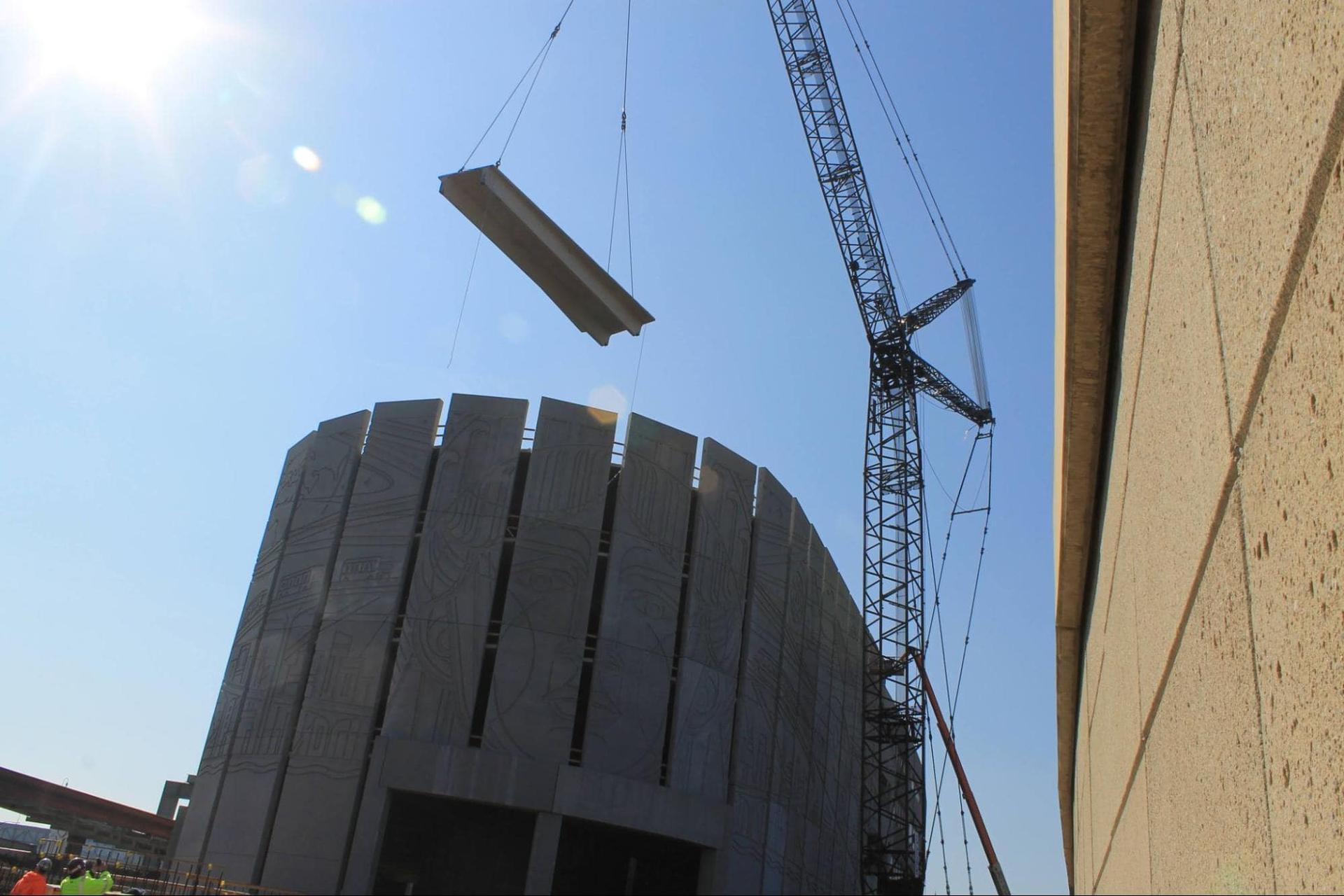a panel being placed on a precast structure