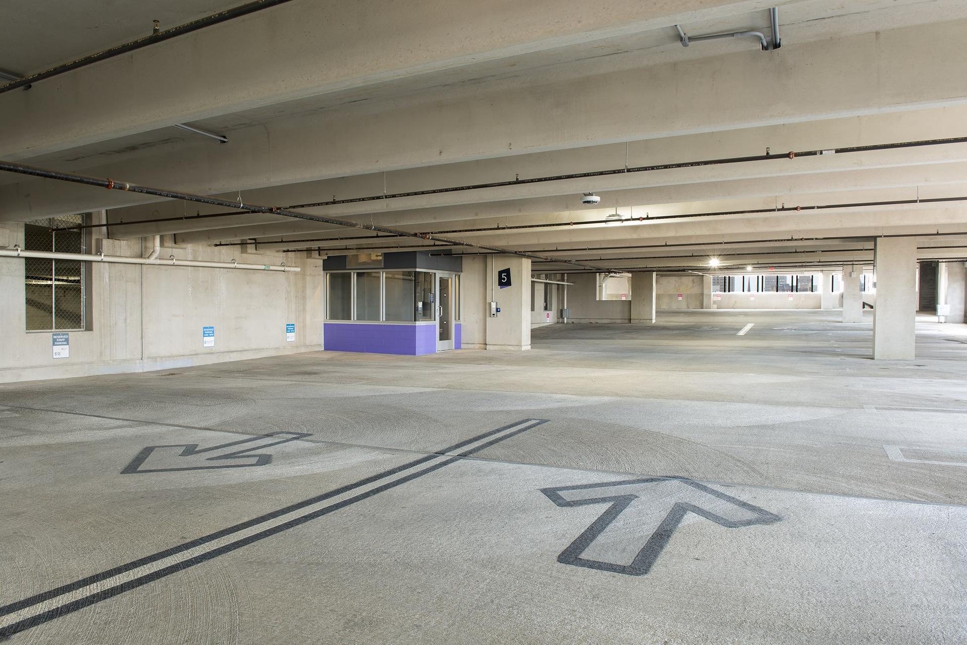 Inside a precast concrete parking garage with columns and beams.