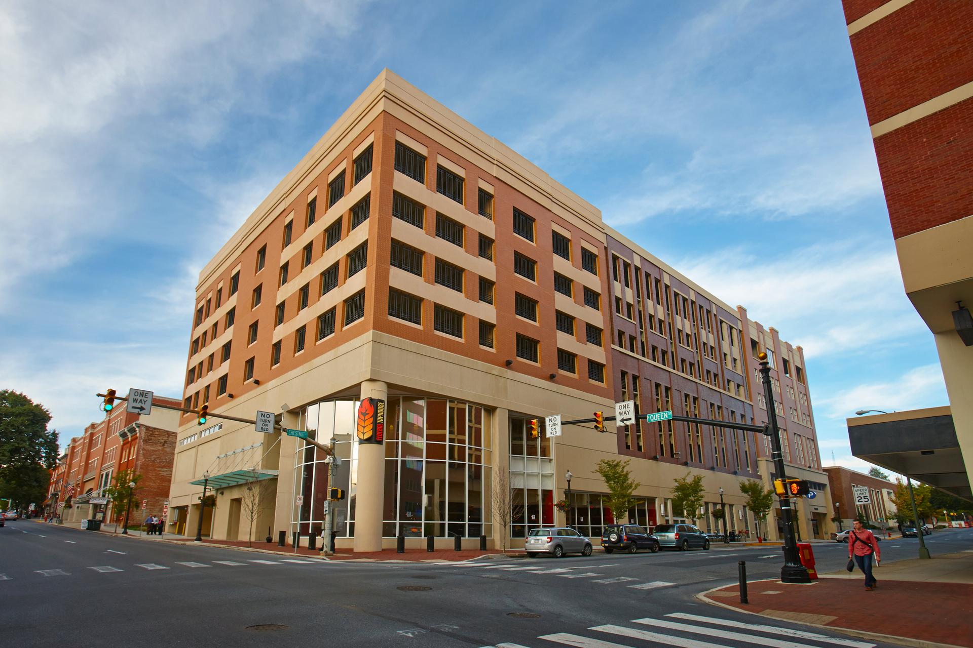 grey and white precast panels on the side of a parking garage