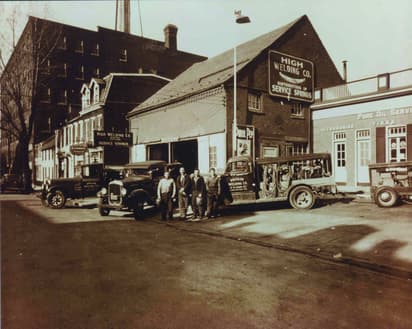 High Welding Company in 1931, Sanford and three co-workers with trucks in front of the welding shop on Lemon Street in Lancaster Pa