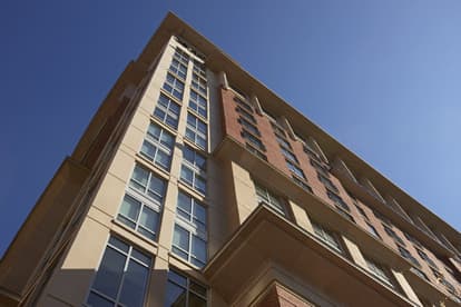 tan and brick precast concrete building