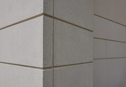 Corner edge of building with reveals and simple sandblast finish